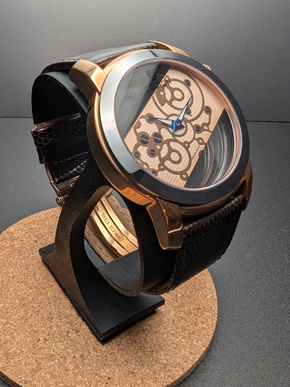 Croton Rose Gold Skeleton Dial Watch with Blue Hands and Brown Leather Strap